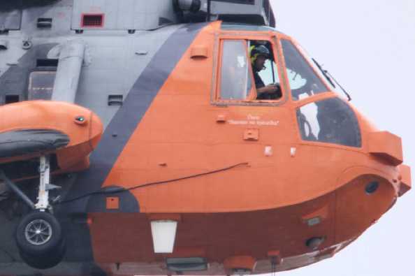 23 July 2020 - 15-02-07
HeliOperations Sea King XV166 flew through decently low. The helicopter name is Dara. The inscription:
"Dara Banríon na spéadtha"  - translated:  Dara, Queen of the Skies. Dara Fitzpatrick was Irish Coast Guard’s senior helicopter search and rescue pilot. She died March 2017 whilst Captain of the Irish Coast Guard Dublin-based Rescue 116 helicopter.
------------------
HeliOperations Sea King XV166
